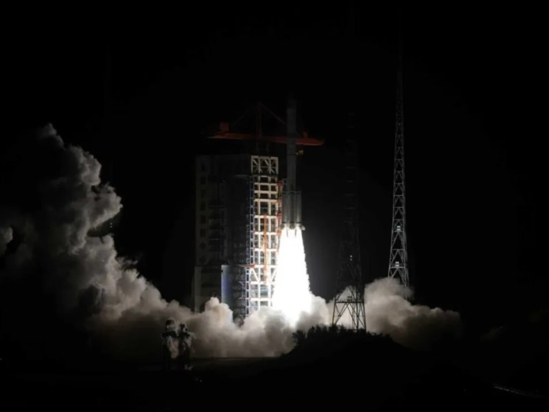 A Long March 6A rocket lifts off at night from Taiyuan Satellite Launch Center in China, carrying the Yaogan-40 (03) remote sensing satellites. Bright exhaust flames and thick plumes of smoke illuminate the dark launch pad.